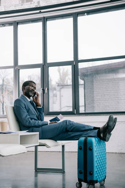 istock businessman talking by smartphone 903772164