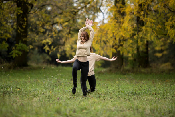 istock Young Couple Dancing On Grassy Field At Park 903778250