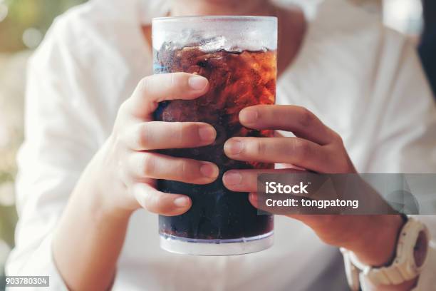 Woman Hand Giving Glass Soft Drinks With Ice Sweethart Or Buddy Stock Photo - Download Image Now