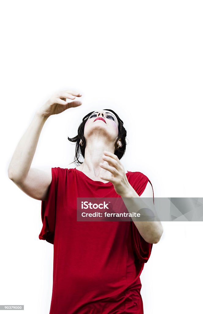 Women in red Women in red dancing/performing with her arms raised. Mime Artist Stock Photo