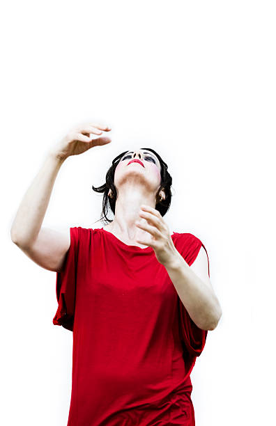 Women in red Women in red dancing/performing with her arms raised. pantomime dame stock pictures, royalty-free photos & images