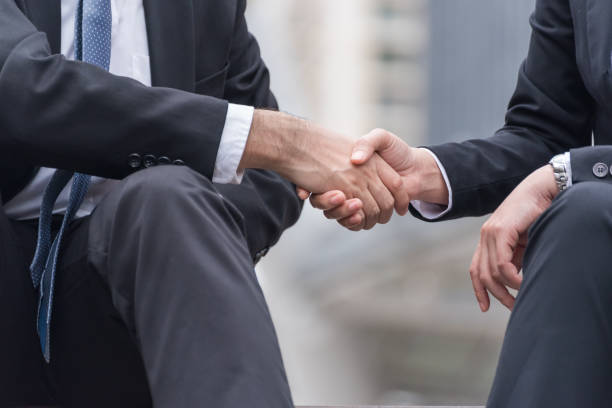 istock Midsection Of Business People Shaking Hands 903790334