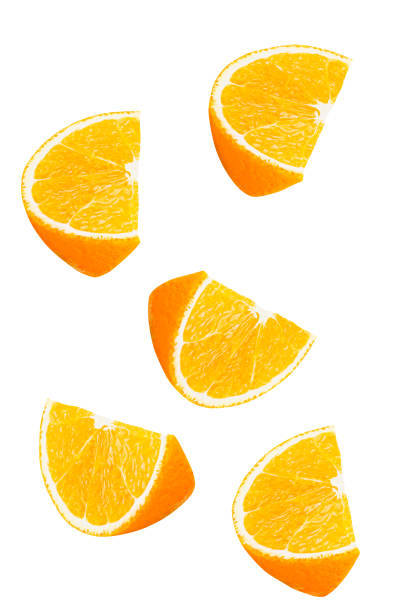 istock Isolated falling orange fruits pieces. 903791742