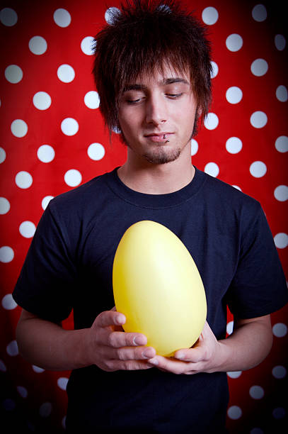 istock teenage young male portraits - easter eggs 90379630