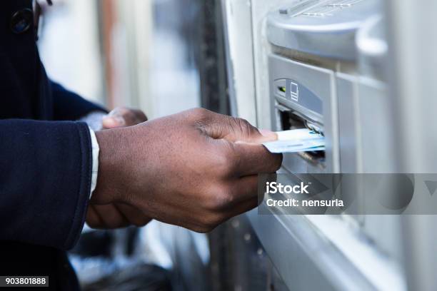 Close Up Of Man Taking Cash From Atm With Credit Card Stock Photo - Download Image Now