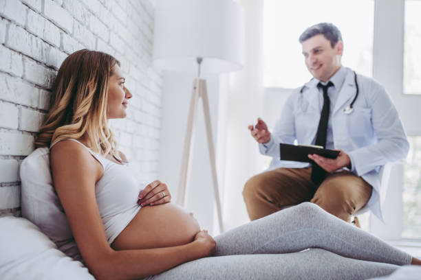 istock Pregnant woman with doctor. 903803090