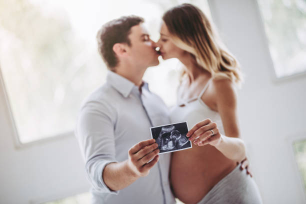 Pregnant woman with husband.