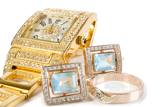 Golden watch, bangle and an earrings