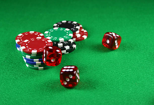 istock Action shot of 5 dice thrown onto the table 90381424