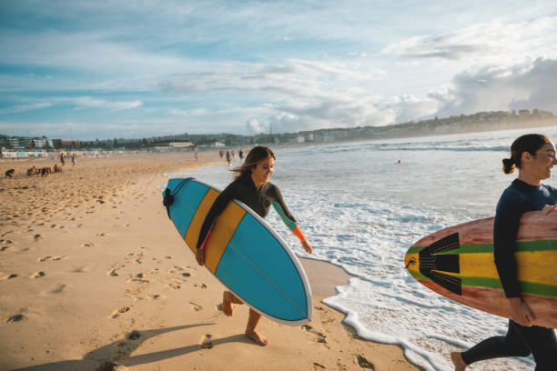 istock Two female athletes are crazy for leisure surfing 903819830