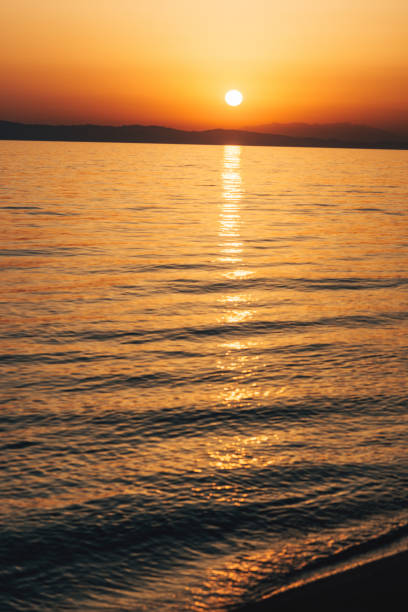istock Vibrant sunset and horizon over the water 903822642