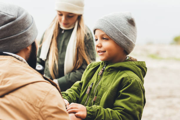 istock father spending time with kids outdoors 903822978