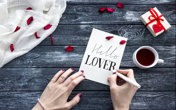 istock Female hands writing down on letter paper for Valentine's day 903824690