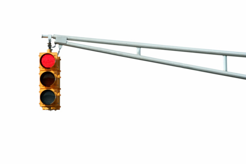 Isolated Red traffic signal light on white