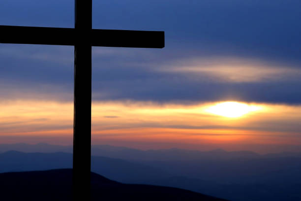 istock the cross at dawn in the mountains 903829858