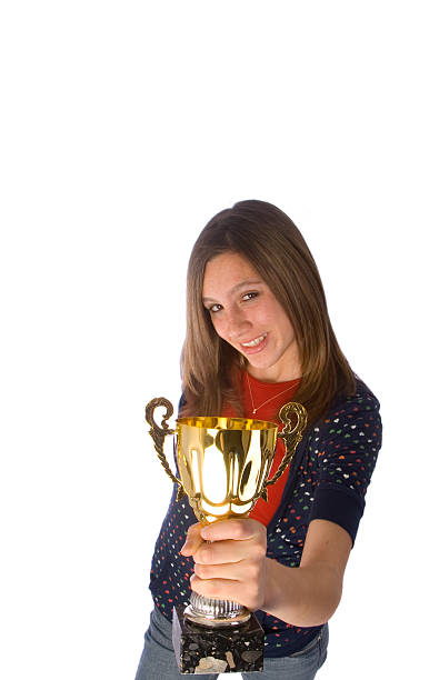 istock teen girl presenting trophy 90383515