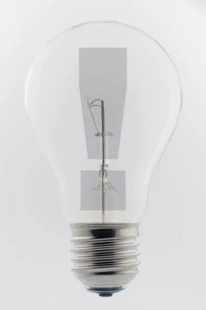Photo of an old light bulb with an exclamation mark