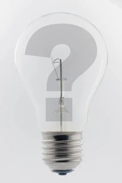 Photo of an old light bulb with a question mark
