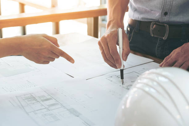 istock Image of engineer or architectural project, Close up of hands architects engineering working on blueprint with engineering equipment tool, Construction concept 903845468
