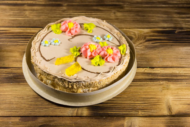 istock Cardboard box with Kiev cake with cream, nuts and meringue 903850642