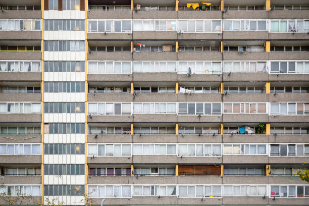 Facade of old council tower block in south east London Facade of old council tower block around Walworth area in south east London council flat stock pictures, royalty-free photos & images