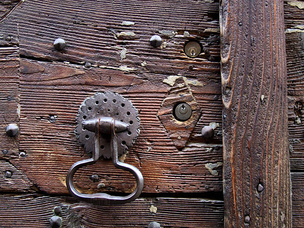 istock Wooden door, knocker and keyholes 90387331