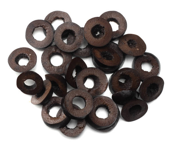 istock Marinated slices black olives isolated on white background. top view 903873938