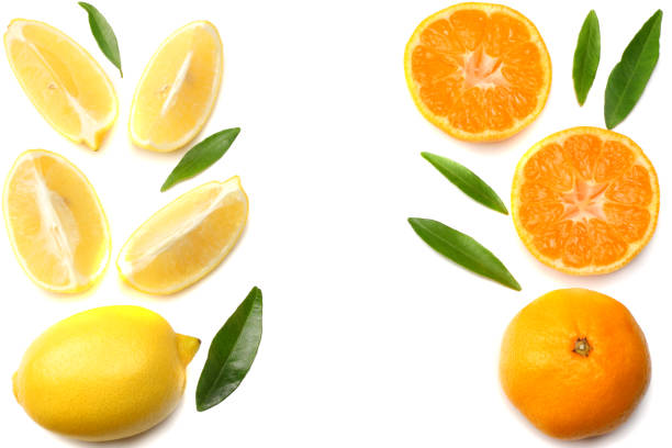 istock mandarin with slices, lemon and green leaf isolated on white background top view 903873970