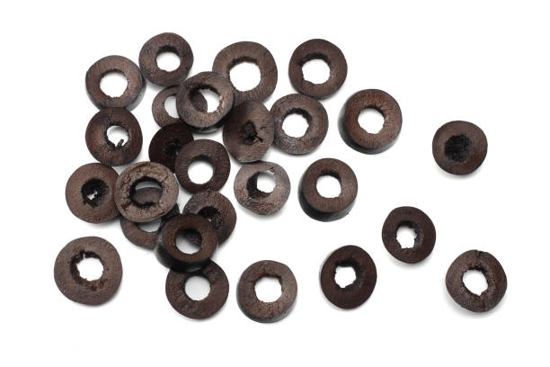 istock Marinated slices black olives isolated on white background. top view 903874038