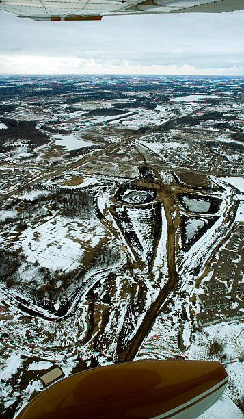 istock Aerial - Airplane Wing/Wheel and Construction Site 90387793