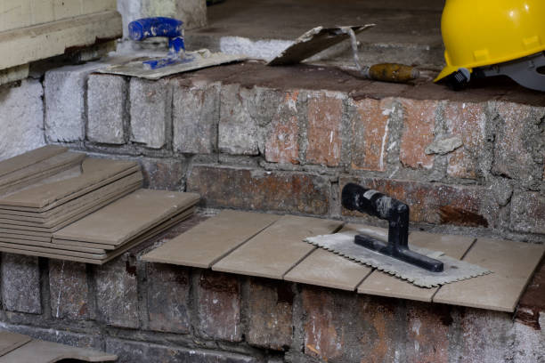 istock A workplace for a master from laying tiles. Tools and accessories as well as tiles when laying. 903885788