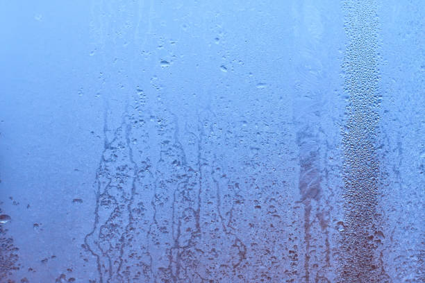 istock Water drops on glass natural bright background 903888204