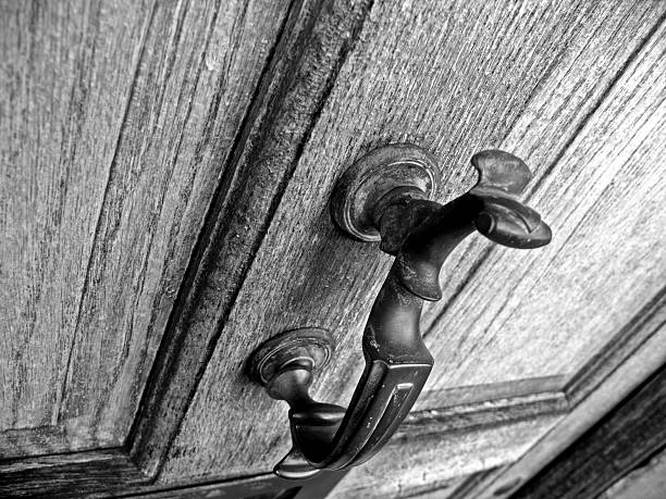 istock Knocker on grainy wooden door 90389169