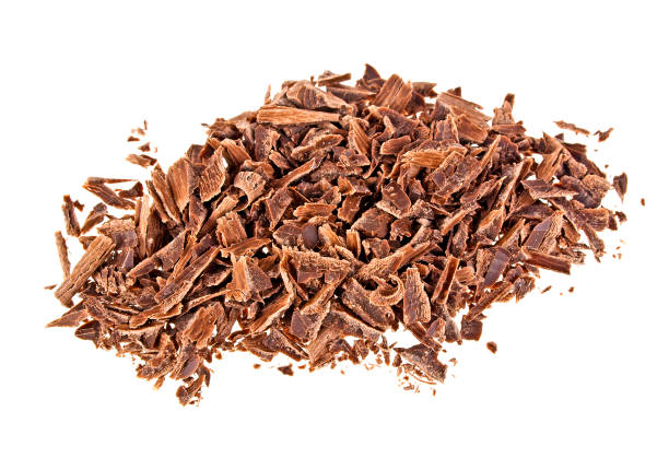 istock Crushed chocolate shavings pile isolated on white background 903892092