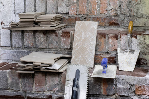 istock A workplace for a master from laying tiles. Tools and accessories as well as tiles when laying. 903893698