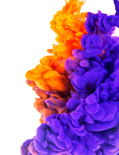istock Violet and orange ink in water isolated on white background 903897494