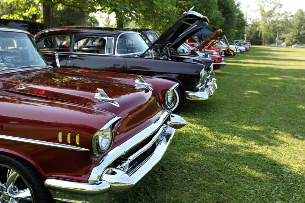 Classic cars on display in Indiana park. Summer show of vintage cars.  USA   1950's vehicles. car show photos stock pictures, royalty-free photos & images