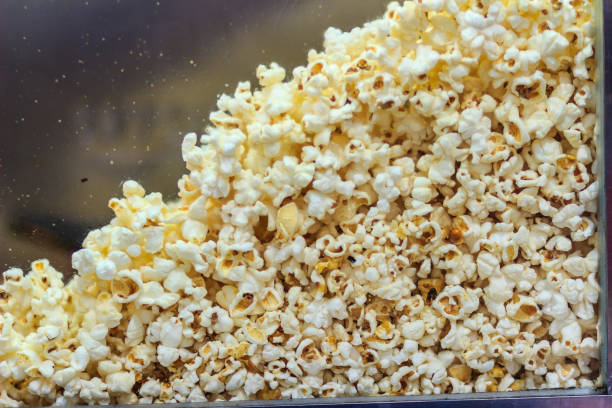 istock Cooked popcorn in the glass showcase for sale. 903901198
