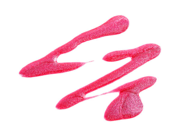 istock Spilled pink nail polish isolated on white background 903907254