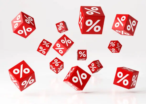 Sale concept, Red cubes with percentage symbols are falling over white reflective surface. standing Horizontal composition with copy space. Clipping path is included. Great use for shopping and Valentine's Day Christmas and Mother"s Day related concepts.