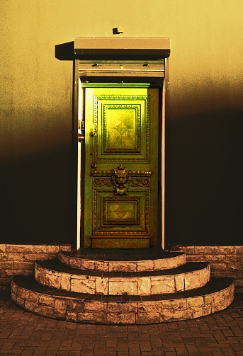 Saint-Petersburg, Russia. The door of one of the houses in the alley of Solyanoy. Photographic film, cross-process.