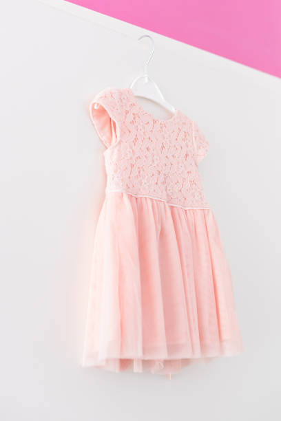 istock Children's dresses on hangers. 903915322