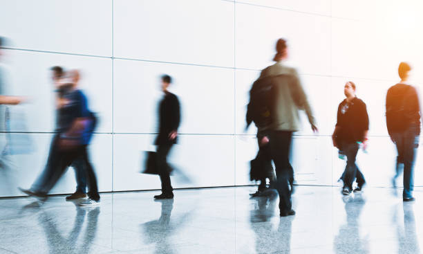 istock blurred crowd of people in a futuristic environment 903921096