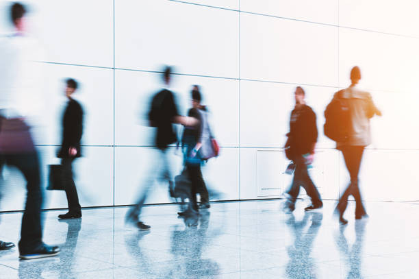 istock blurred crowd of people in a futuristic environment 903921194