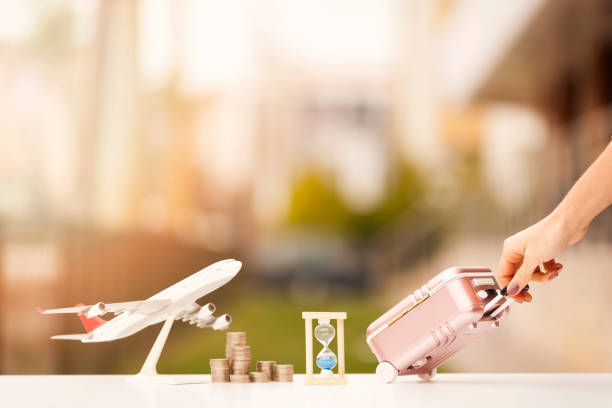 istock Miniature toy airplane and suitcases on bokeh background 903921270