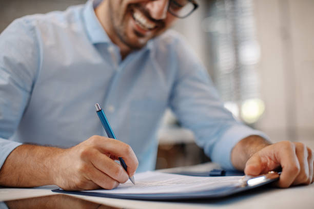 istock Young businessman signing a contract 903923668