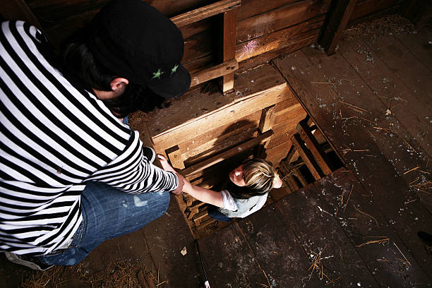 istock Young Man Helping his Girlfriend Up a Ladder 90392568
