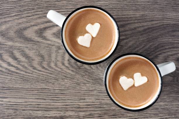 istock Hot chocolate with heart marshmallows over wood 903926022