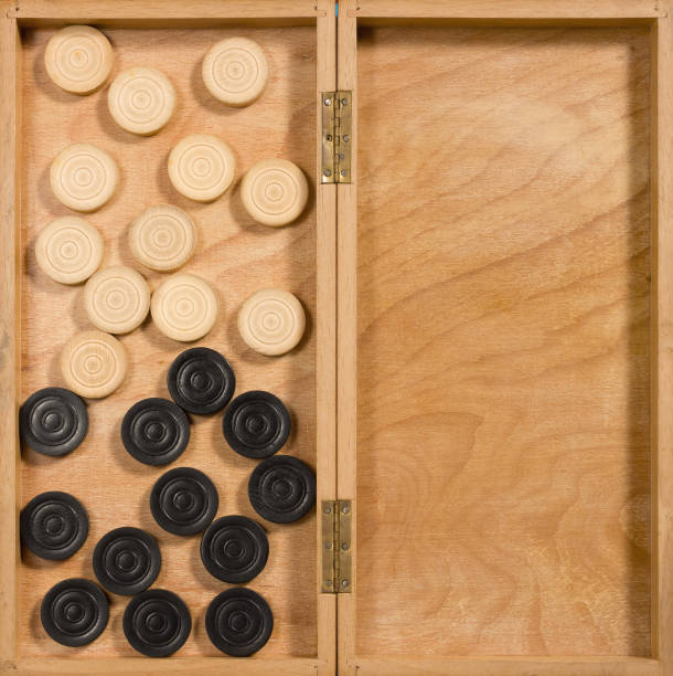 istock Overturned Wooden Checkerboard and its Pieces 903926576