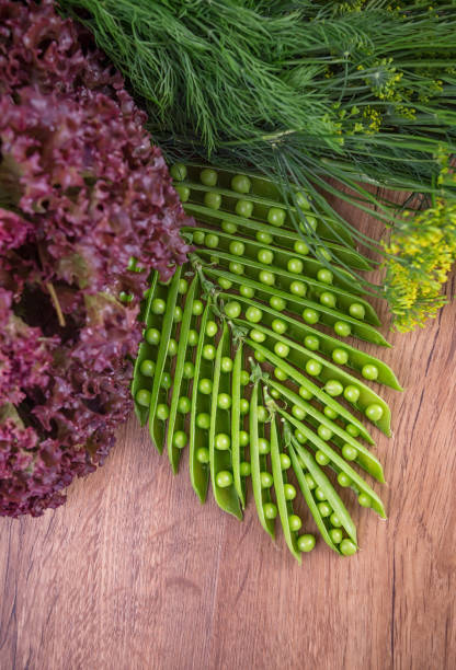 green peas, open pea sticks